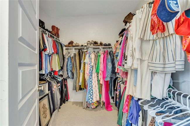 Walk-In Closet via Primary Bathroom | Image 20