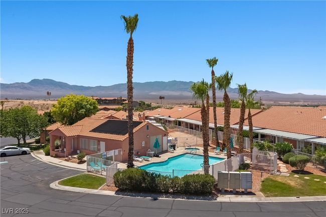 Community pool featuring a patio area, a mountain view, and a residential view | Image 32