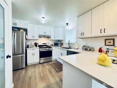 Kitchen with new appliances and a walk-in pantry | Image 3