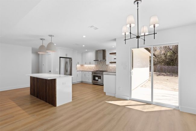 Dining room with entrance to patio and backyard | Image 7