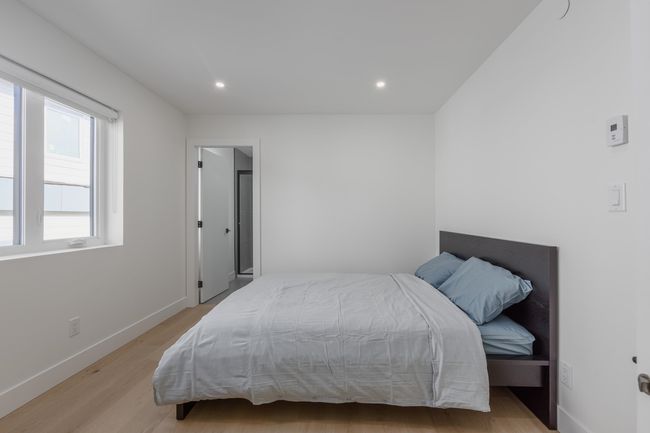 Bedroom featuring recessed lighting, light wood-type flooring, and baseboards | Image 23