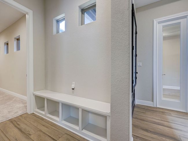 A bench with cubbies by the front door | Image 18