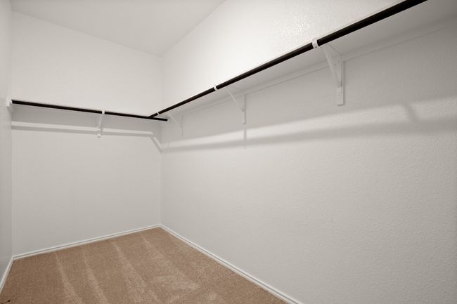 Spacious closet featuring carpet floors | Image 15