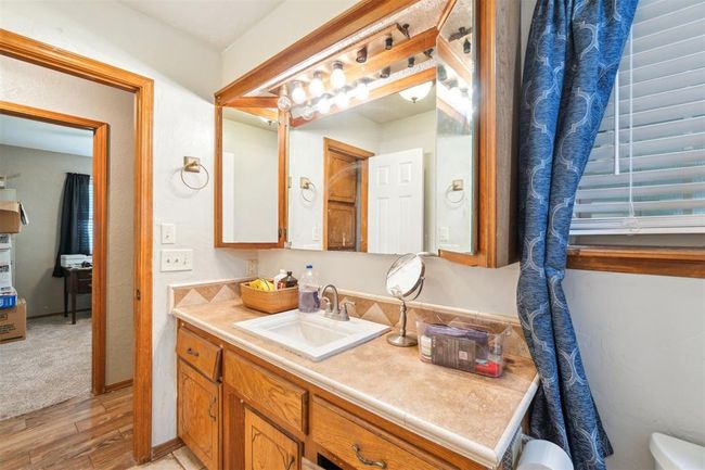 Bathroom with vanity and wood finished floors | Image 29