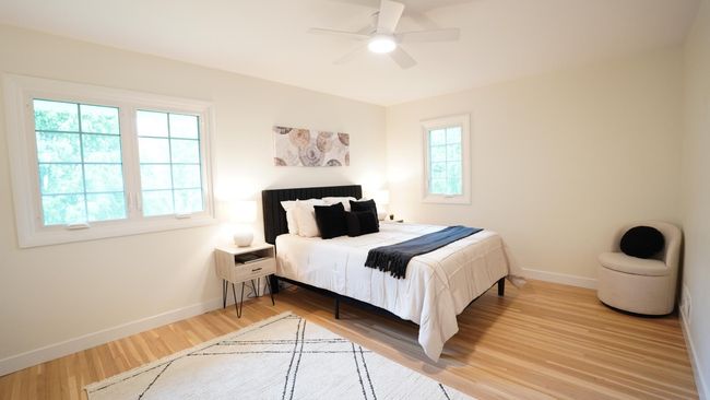 Facing the backyard, the owners' bedroom is both quiet and private. It can easily accommodate a king bed and several more pieces of bedroom furniture. The newly installed ceiling fan provides both a cool breeze and extra light. | Image 24