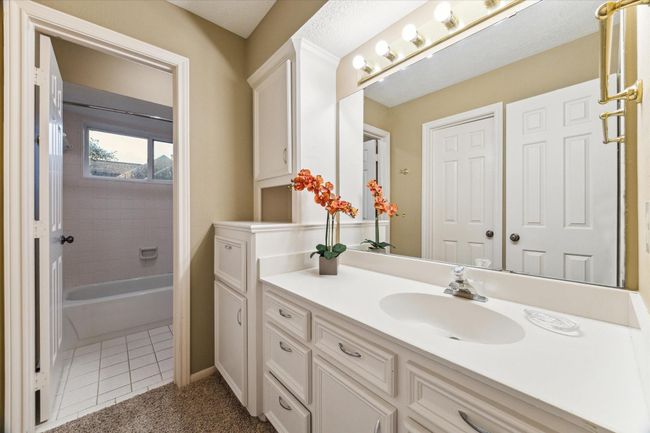 This 12’x5’ secondary ensuite bathroom also opens to a short hall servicing the upstairs den area. | Image 30