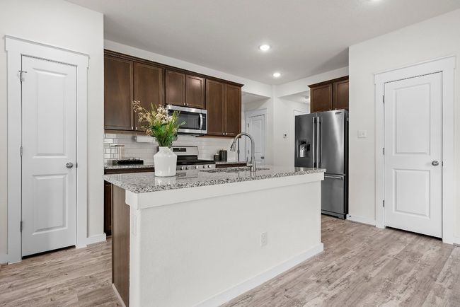 Kitchen with stainless steel appliances and pantry. | Image 8