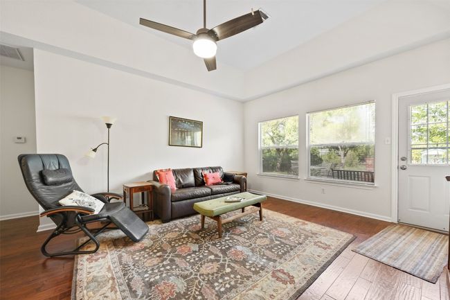 Living area featuring ceiling fan and wood-type flooring | Image 4