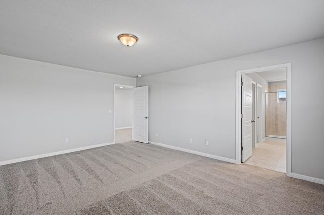 Carpeted spare room featuring baseboards | Image 22