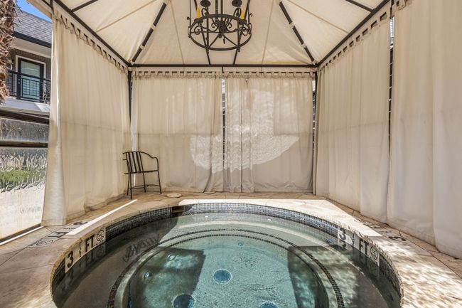 View of swimming pool with an indoor hot tub | Image 27