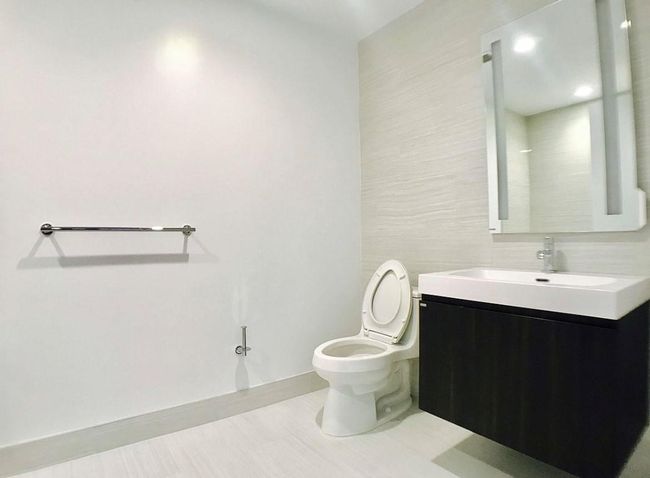 Bathroom featuring toilet and vanity | Image 8