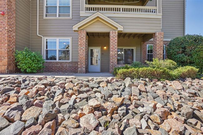 View of the front door and patio area from the parking lot right outside your front door. | Image 5