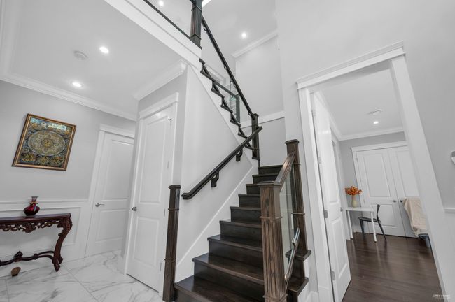 Stairs with crown molding, recessed lighting, and marble finish floors | Image 27