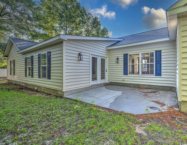Back of property with a patio area, roof with shingles, and a lawn | Image 6