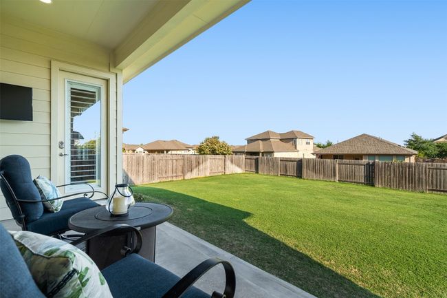 Designed for relaxation and entertaining, the back patio is wired for surround sound and offers a seamless indoor-outdoor living experience. | Image 31