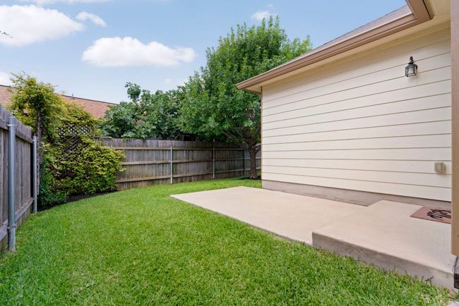 The back patio is ideal for setting up a table and chairs. | Image 19