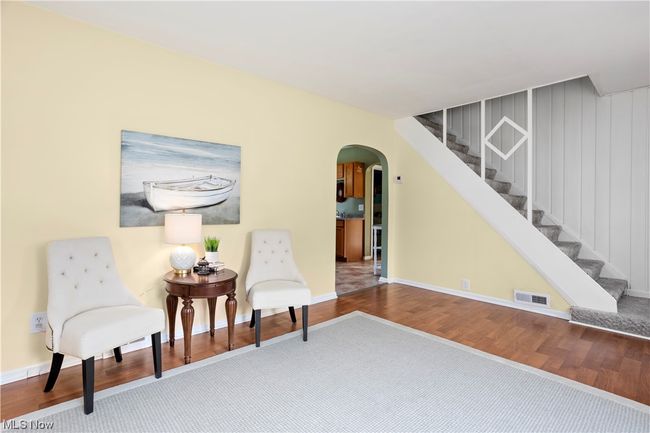 Living area with light hardwood floors | Image 11