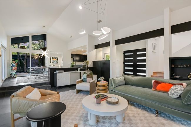Living room with high vaulted ceiling | Image 8