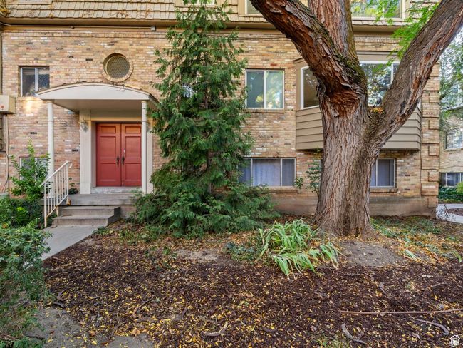 View of exterior entry with brick siding | Image 19