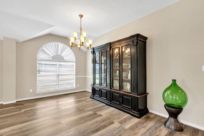 Dining area with an inviting chandelier with lot of room for entertaining | Image 9