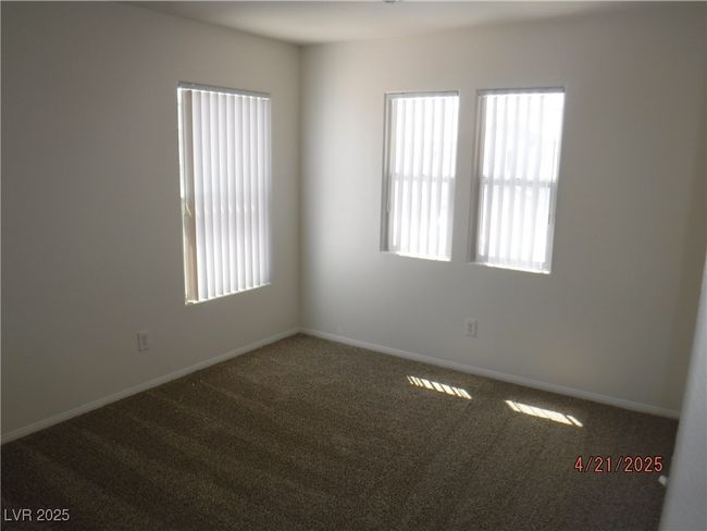 Bedroom featuring baseboards and carpet flooring and new blinds | Image 12