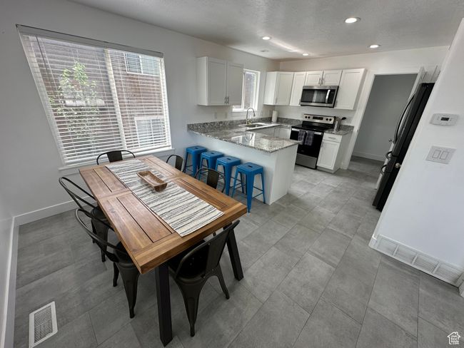 Dining space featuring recessed lighting and baseboards | Image 4