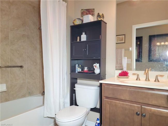 Full bath with shower / tub combo with curtain, toilet, and vanity | Image 23