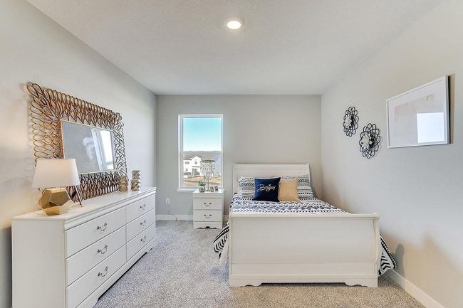 Space is also abundant in each of the home's three secondary bedrooms, all three of which are just steps from the upper-level loft! Photo of model home, color and options will vary. | Image 17
