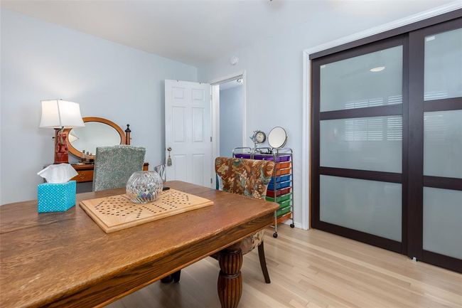 Dining space featuring vaulted ceiling and light hardwood / wood-style flooring | Image 25
