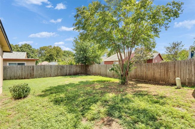 View of fenced backyard | Image 19