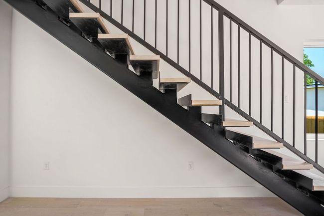Stairs with baseboards and wood finished floors | Image 10