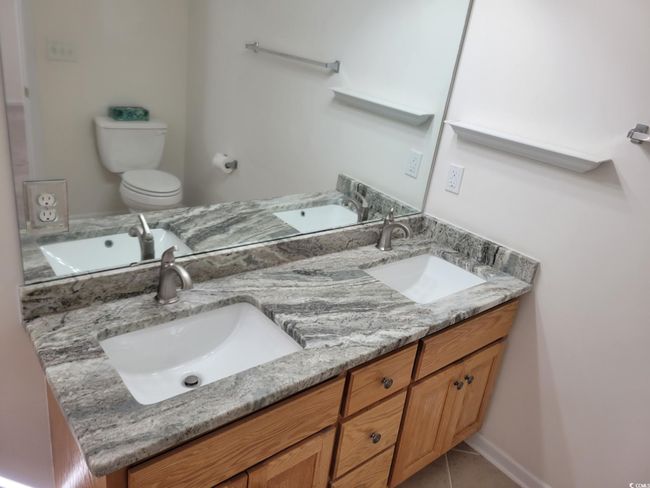 Full bathroom featuring double vanity and tile patterned flooring | Image 34