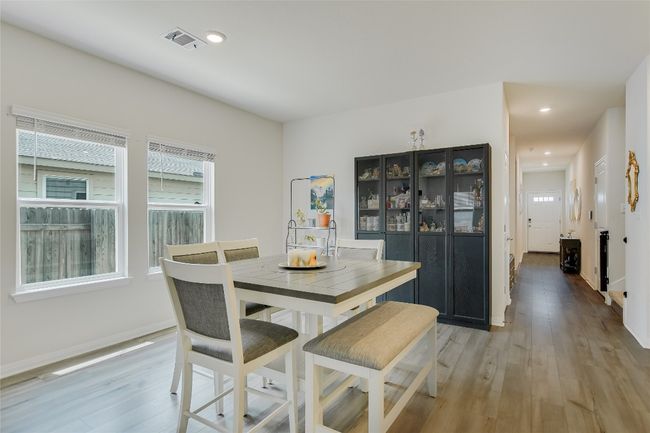 Dining room with light wood-style floors, baseboards, and recessed lighting | Image 5