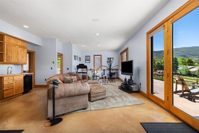 Living area with recessed lighting and light colored carpet | Image 12