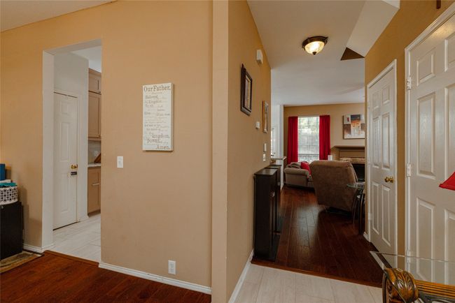 Hallway with baseboards and light wood-style flooring | Image 8