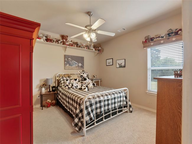 Bedroom featuring carpet floors, baseboards, and a ceiling fan | Image 12