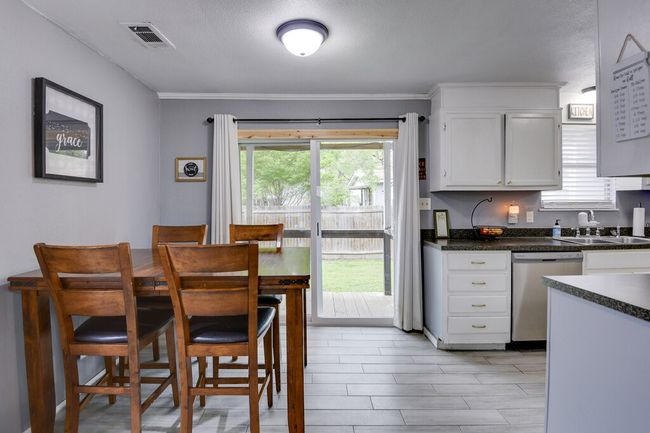 Kitchen dining leads to the private back yard | Image 9
