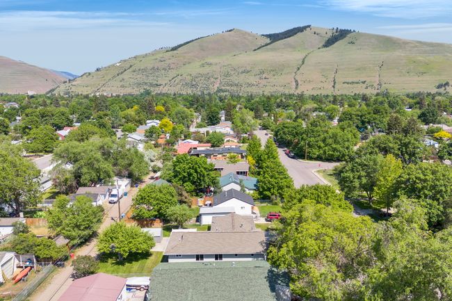 Aerial view of residential area featuring a mountainous background | Image 52