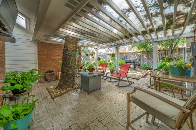 Fenced backyard with a pergola and a patio | Image 16