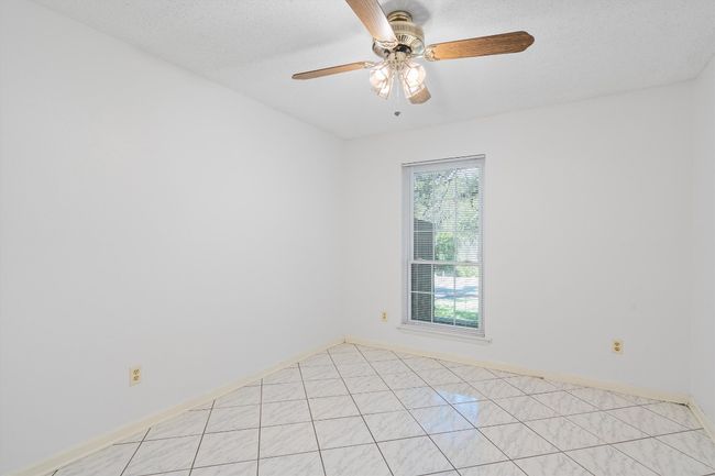 Empty room with baseboards and a ceiling fan | Image 31