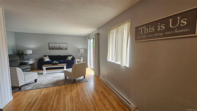 There are patio doors from living room to yard | Image 4