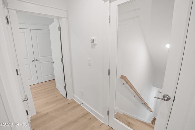Hall to master Bedroom and downstairs garage | Image 133