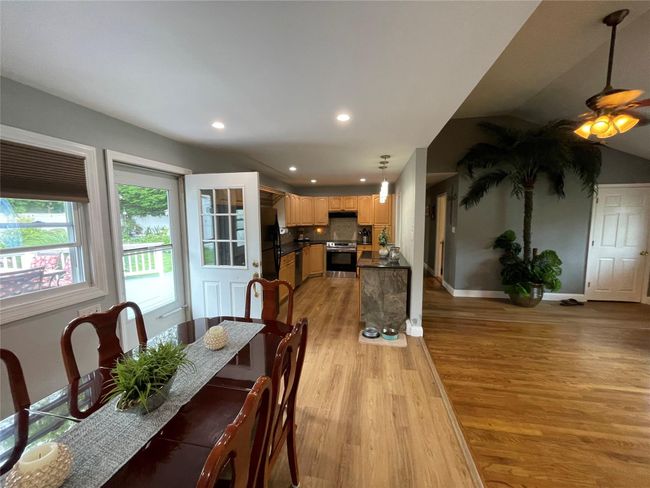 Dining area with light wood-style floors, recessed lighting, baseboards, and ceiling fan | Image 14