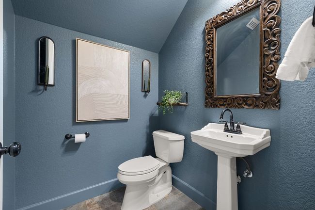 Downstairs powder bath for guests. | Image 22