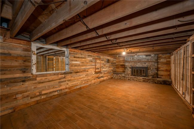 Finished Room with Wood-Burning Fireplace in Partially Finished Basement | Image 38