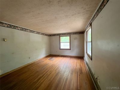 Spare room with a textured ceiling and hardwood / wood-style floors | Image 3