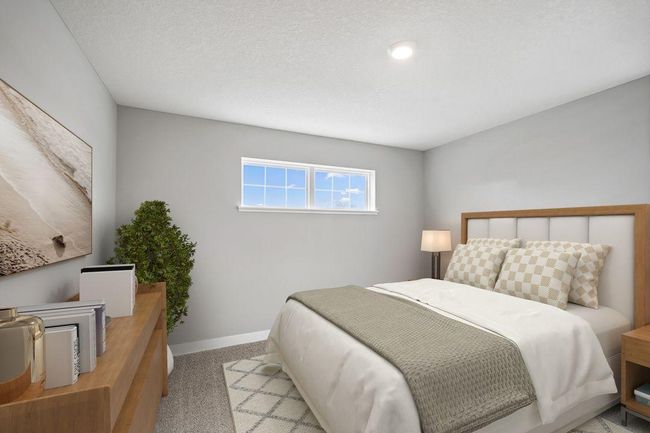 Spacious secondary bedroom with natural light. Model photos. Options and colors will vary. | Image 31