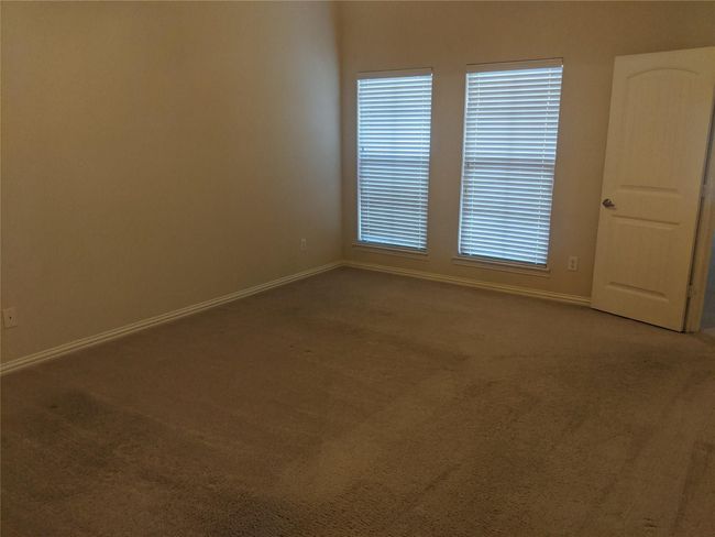 Primary bedroom split from the second bedroom upstairs. Enjoy the balcony seating area! | Image 7