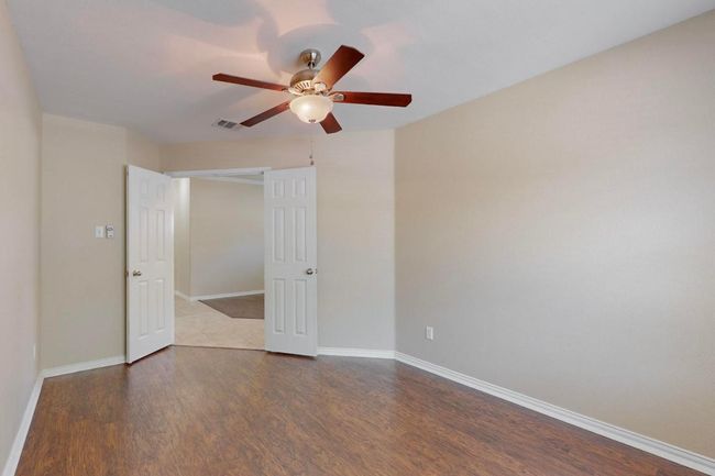 Office/hobby room/GYM located at the front of the home. Double doors and wood looking vinyl plank flooring for easy clean up and durability. THis is a great home office space, there is no closet in this room. | Image 16