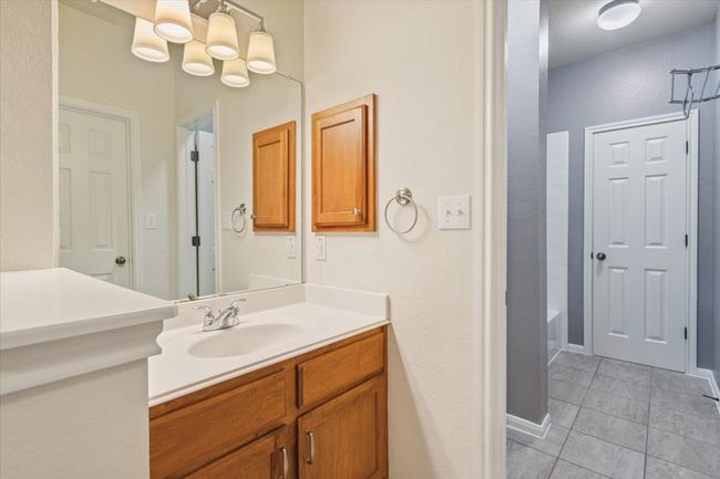 Full bathroom featuring vanity and tile patterned floors | Image 25